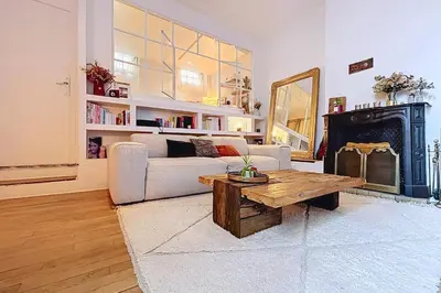Coin salon dans l'établissement Spacieux Apt Oberkampf près Bastille