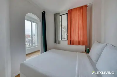 Un ou plusieurs lits dans un hébergement de l'établissement Studio lumineux près du Parc des Buttes-Chaumont