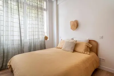 Un ou plusieurs lits dans un hébergement de l'établissement Appartement cosy pour 4 Paris