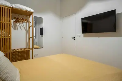 Un ou plusieurs lits dans un hébergement de l'établissement Appartement cosy pour 4 Paris