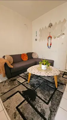 Coin salon dans l'établissement Jolie appartement au centre de Paris