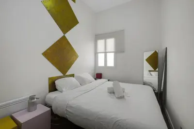 Un ou plusieurs lits dans un hébergement de l'établissement Paris Arty Lovers