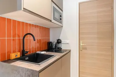 Cuisine ou kitchenette dans l'établissement Chic studio Neuf Batignolles