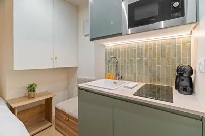 Cuisine ou kitchenette dans l'établissement Charmante suite paris 17E