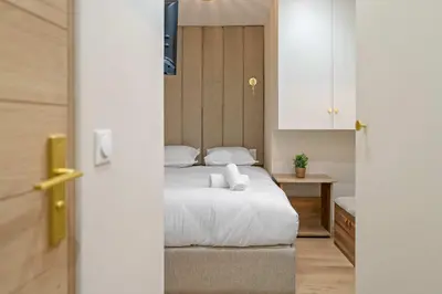 Un ou plusieurs lits dans un hébergement de l'établissement Charmante suite paris 17E