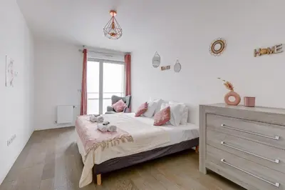 Un ou plusieurs lits dans un hébergement de l'établissement Havre lumineux face aux Buttes-Chaumont