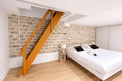 Un ou plusieurs lits dans un hébergement de l'établissement Appartement Paris 18eme Montmartre 6 personnes