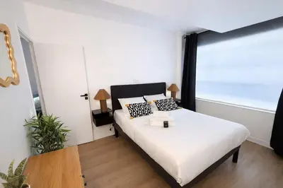 Un ou plusieurs lits dans un hébergement de l'établissement Appartement Paris 18eme Montmartre 6 personnes