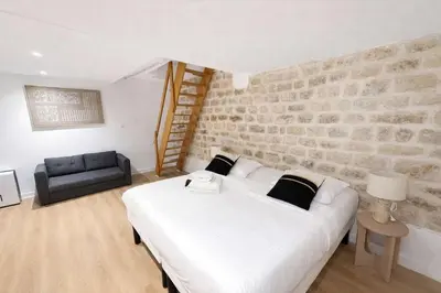 Un ou plusieurs lits dans un hébergement de l'établissement Appartement Paris 18eme Montmartre 6 personnes
