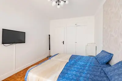 Un ou plusieurs lits dans un hébergement de l'établissement Apt 3 chambres -Tour Eiffel- Arc de triomphe
