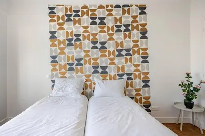 Un ou plusieurs lits dans un hébergement de l'établissement Apt 3 chambres -Tour Eiffel- Arc de triomphe