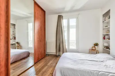 Un ou plusieurs lits dans un hébergement de l'établissement Appartement paisible et soigné