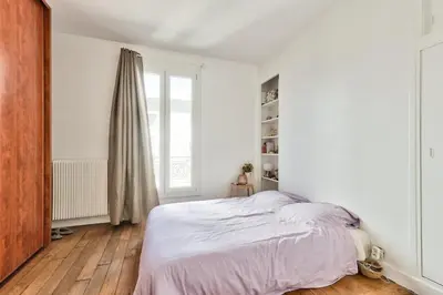 Un ou plusieurs lits dans un hébergement de l'établissement Appartement paisible et soigné
