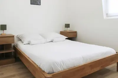 Un ou plusieurs lits dans un hébergement de l'établissement Bel appartement au cœur d'Asnières