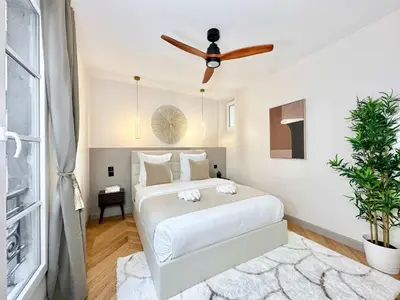 Un ou plusieurs lits dans un hébergement de l'établissement Gare du Nord prestige family apartment for 6