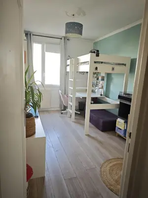 Un ou plusieurs lits dans un hébergement de l'établissement Appartement spacieux proche du Père Lachaise
