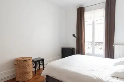 Un ou plusieurs lits dans un hébergement de l'établissement Bel appartement familial