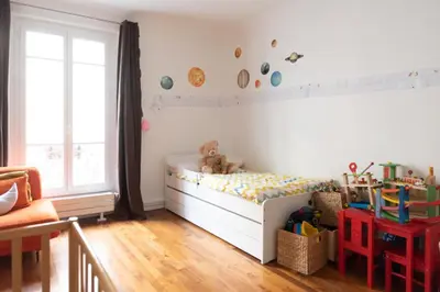 Un ou plusieurs lits dans un hébergement de l'établissement Bel appartement familial