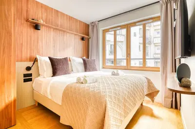 Un ou plusieurs lits dans un hébergement de l'établissement Paris La Belle - Lafayette