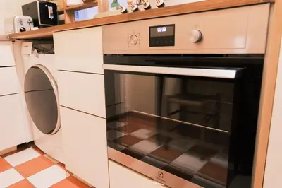 Cuisine ou kitchenette dans l'établissement Authentic flat near Montmartre