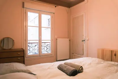 Un ou plusieurs lits dans un hébergement de l'établissement Authentic flat near Montmartre