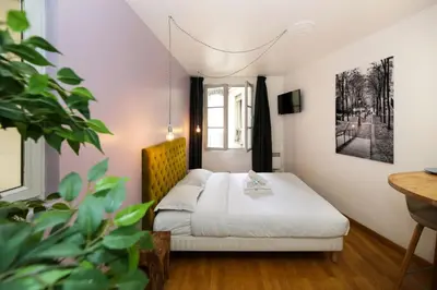 Un ou plusieurs lits dans un hébergement de l'établissement Appartement service - En face du Musee - Paris 5