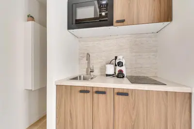 Cuisine ou kitchenette dans l'établissement Magnifique Studio ile saint louis - Paris 4 - 2P