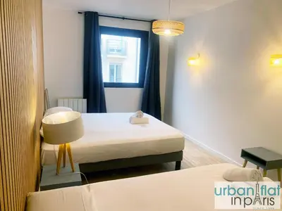 Un ou plusieurs lits dans un hébergement de l'établissement UrbanFlat 167 - Bel Appartement de 1 Chambre