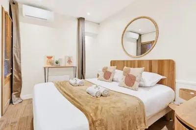 Un ou plusieurs lits dans un hébergement de l'établissement Beautiful flat with AC for 4 pax - Opera
