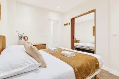 Un ou plusieurs lits dans un hébergement de l'établissement Beautiful flat with AC for 4 pax - Opera