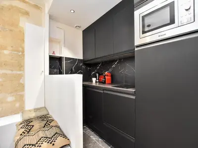 Cuisine ou kitchenette dans l'établissement Cozy apartment - 1BR 4P - Sentier