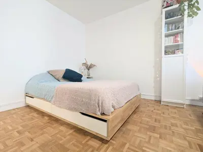 Un ou plusieurs lits dans un hébergement de l'établissement Grand studio calme balcon