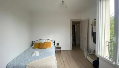 Un ou plusieurs lits dans un hébergement de l'établissement Cute apartment in Paris