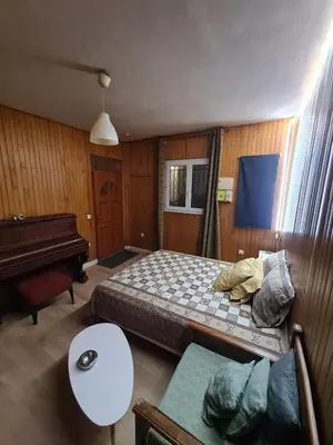 Un ou plusieurs lits dans un hébergement de l'établissement Quiet studio ideal for couples