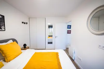 Un ou plusieurs lits dans un hébergement de l'établissement Sky One La Defense