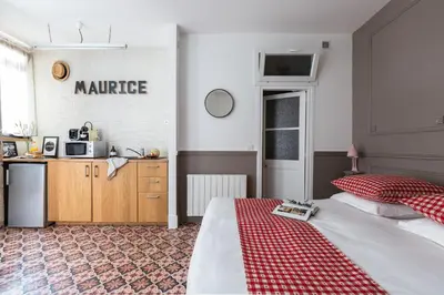 Un ou plusieurs lits dans un hébergement de l'établissement Artisan Lofts courtyard Opéra