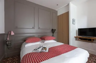 Un ou plusieurs lits dans un hébergement de l'établissement Artisan Lofts courtyard Opéra