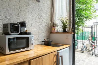 Cuisine ou kitchenette dans l'établissement Artisan Lofts courtyard Opéra