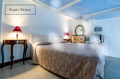 Un ou plusieurs lits dans un hébergement de l'établissement Grand Hôtel du Bel Air