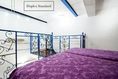 Un ou plusieurs lits dans un hébergement de l'établissement Grand Hôtel du Bel Air