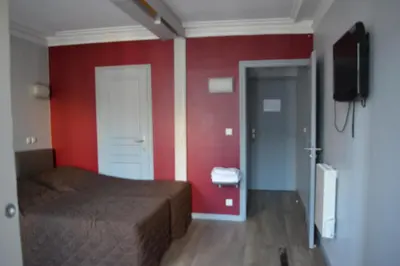 Télévision ou salle de divertissement dans l'établissement Hôtel Allety
