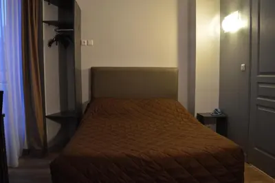 Un ou plusieurs lits dans un hébergement de l'établissement Hôtel Allety