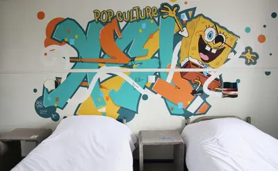 Un ou plusieurs lits dans un hébergement de l'établissement Absolute Hotel Paris République