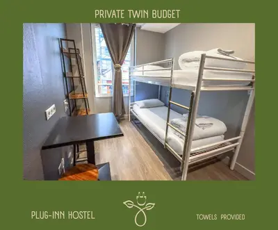 Un ou plusieurs lits dans un hébergement de l'établissement Plug inn Montmartre by Hiphophostels