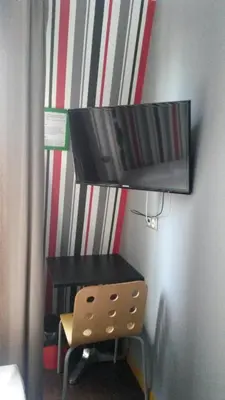 Télévision ou salle de divertissement dans l'établissement Oops! Latin quarter by Hiphophostels