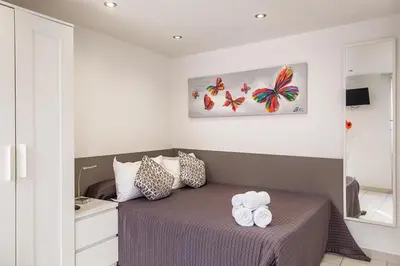 Un ou plusieurs lits dans un hébergement de l'établissement Hotel De L'Horloge