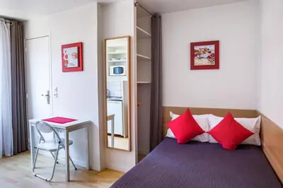 Un ou plusieurs lits dans un hébergement de l'établissement Hotel De L'Horloge
