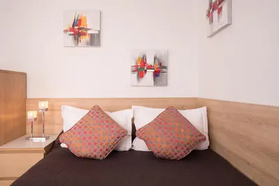 Un ou plusieurs lits dans un hébergement de l'établissement Hotel De L'Horloge