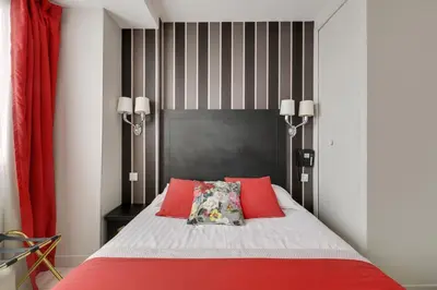 Un ou plusieurs lits dans un hébergement de l'établissement Hotel Riviera Elysees