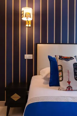 Un ou plusieurs lits dans un hébergement de l'établissement Hotel Riviera Elysees